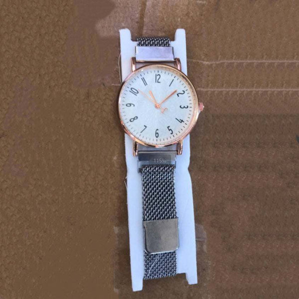 Men's sports pointer quartz watch with round dial, alloy case, and metal mesh strap on white display cushion